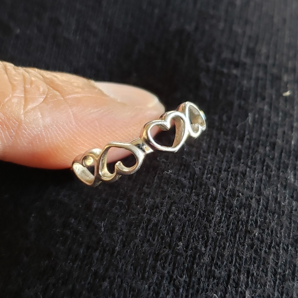 4 hearts sterling silver ring. Size 7